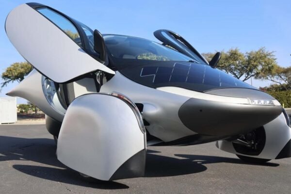 Solar car with integrated solar panels charging in sunlight